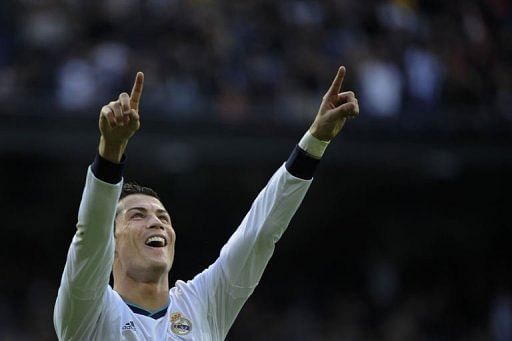 Real Madrid's forward Cristiano Ronaldo celebrates after scoring in Madrid on April 6, 2013